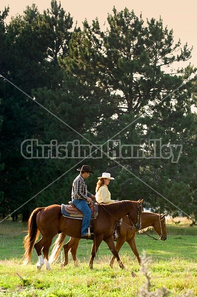 Husband and Wife Trail Riding Together