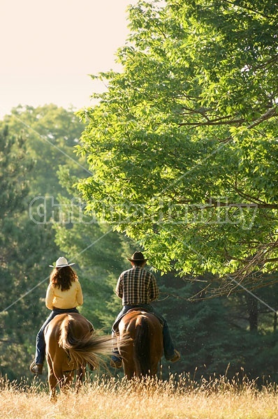 Husband and Wife Trail Riding Together