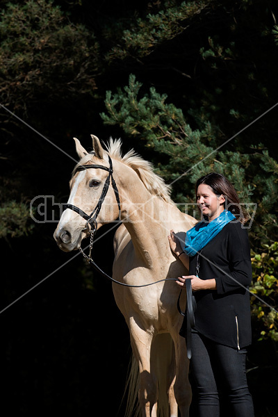 Woman with a palomino horse