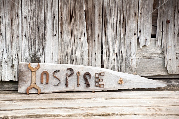 Hand crafted Inspire art sign made out of wood and recycled or repurposed farm tools and machinery parts