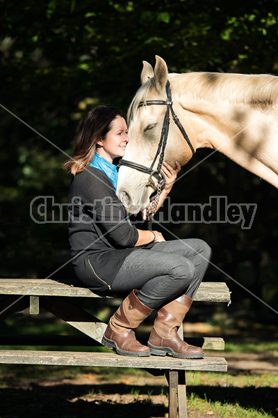 Woman with a palomino horse