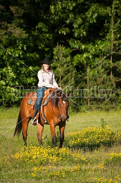 Young woman trail riding in Ontario Canada