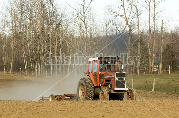 Farmer working a field in the springtime