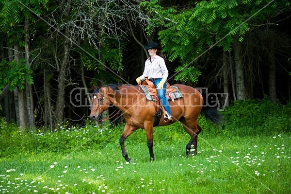 Young woman trail riding in Ontario Canada