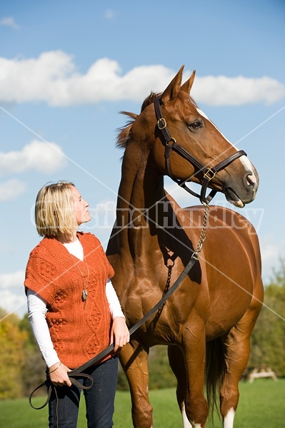 Young woman with her horse