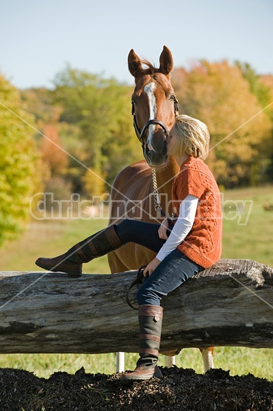 Young woman with her horse