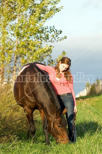 Young woman and her horse