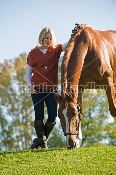 Young woman with her horse