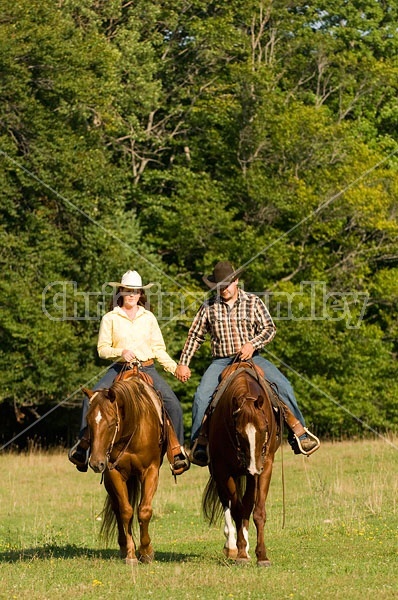 Husband and Wife Trail Riding Together