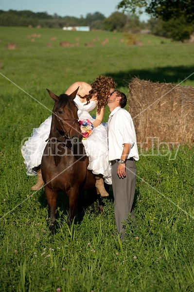 Bride and groom with horse