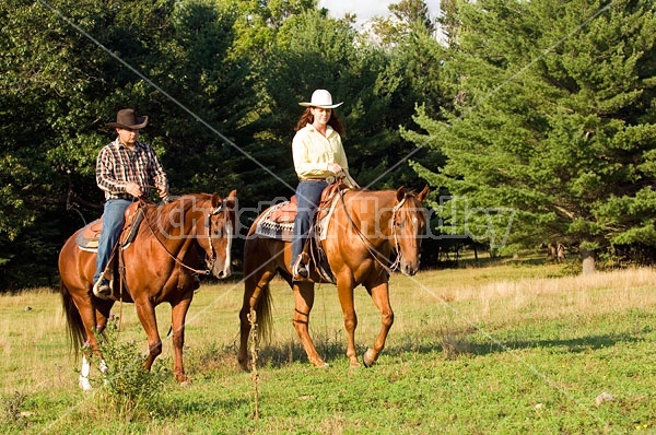 Husband and Wife Trail Riding Together