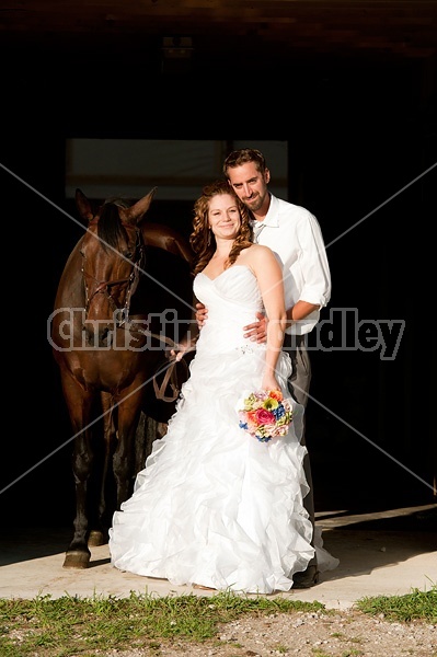 Bride and groom with horse