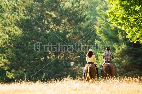 Husband and Wife Trail Riding Together