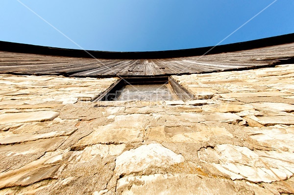 Looking up at an old barn wall