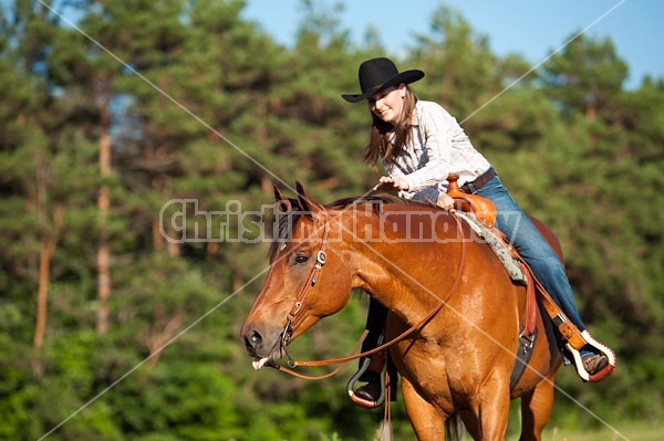 Young woman riding an American Quarter Horse gelding 