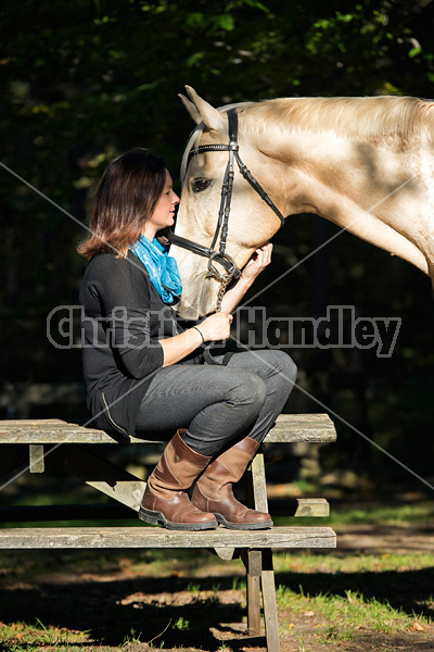 Woman with a palomino horse