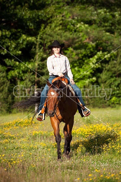 Young woman trail riding in Ontario Canada