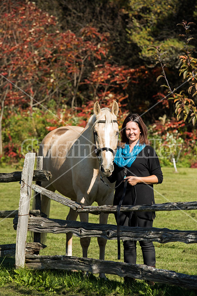 Woman with a palomino horse