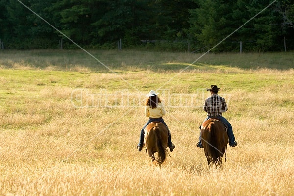 Husband and Wife Trail Riding Together