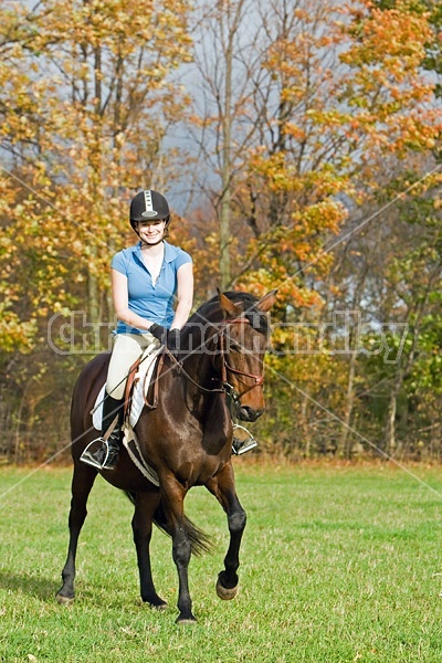 Young woman horseback riding