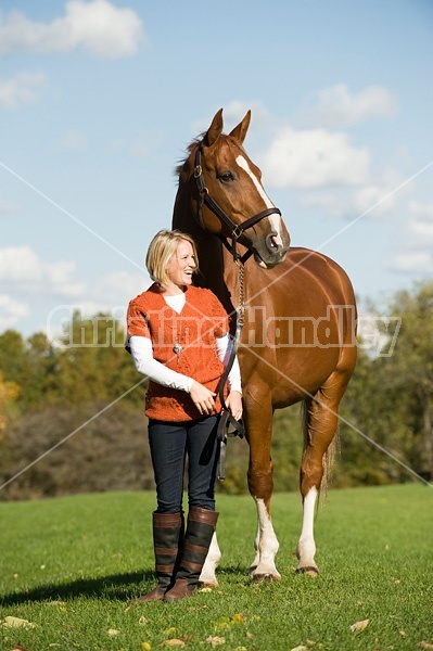 Young woman with her horse