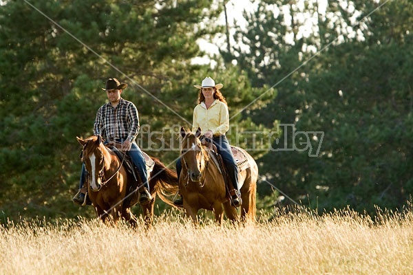 Husband and Wife Trail Riding Together