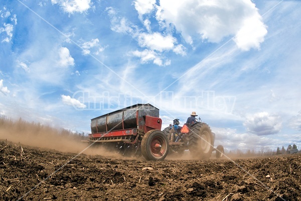 Farmer seeding oats in the springtime