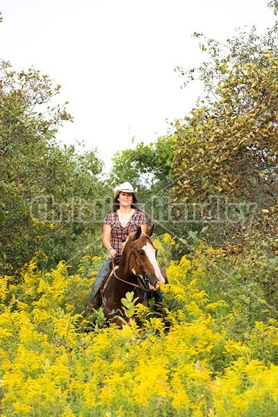 Young woman horseback riding western 