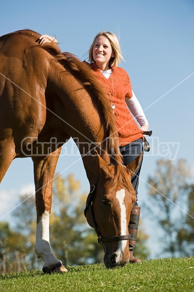 Young woman with her horse