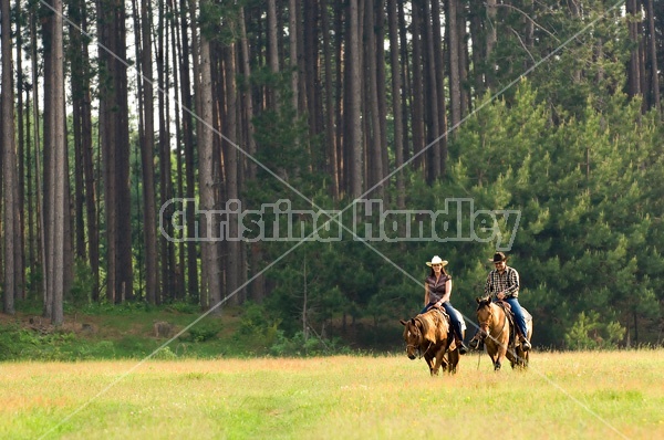 Young couple horseback riding