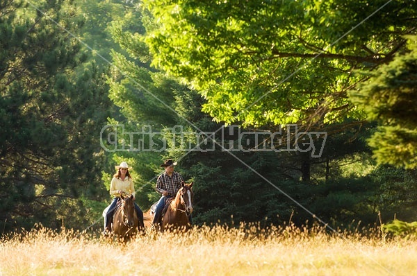 Husband and Wife Trail Riding Together