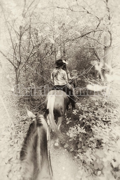 Photo of two women riding double