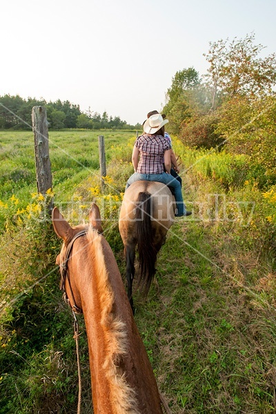 Photo of two women riding double