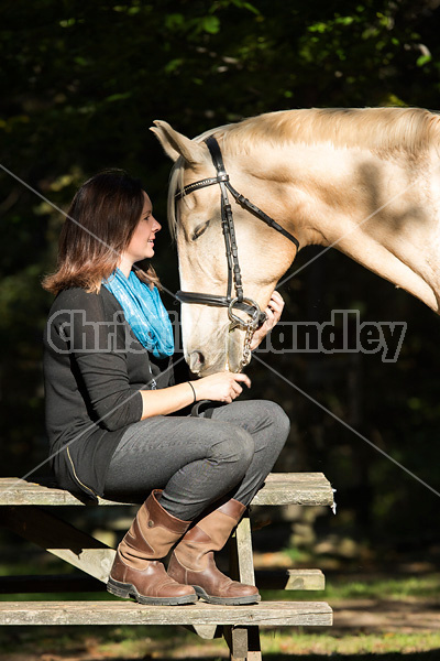 Woman with a palomino horse