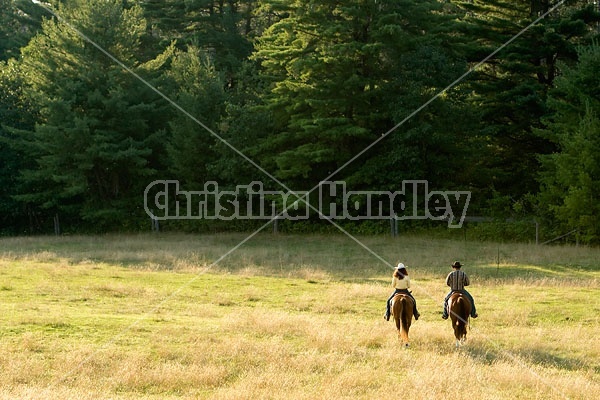 Husband and Wife Trail Riding Together