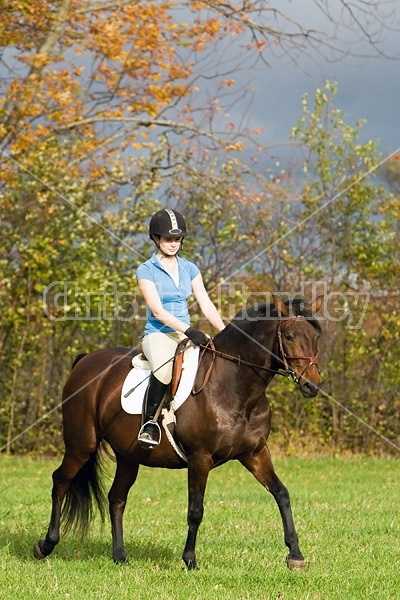 Young woman horseback riding