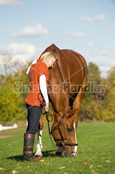 Young woman with her horse