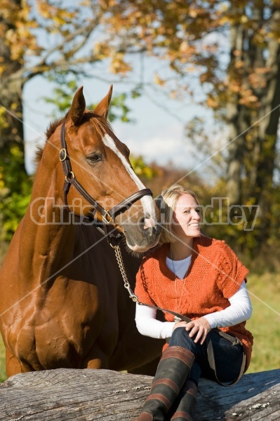 Young woman with her horse