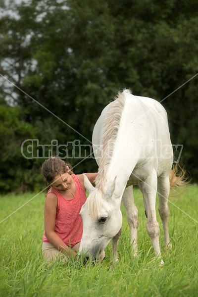 Portrait of a young girl with a gray pony