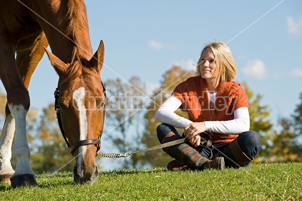 Young woman with her horse