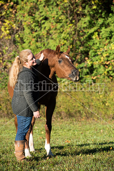 Woman with her Thoroughbred horse