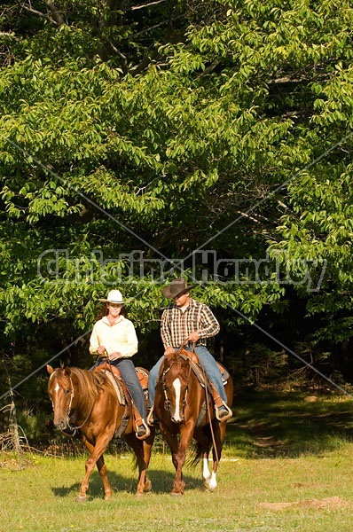 Husband and Wife Trail Riding Together