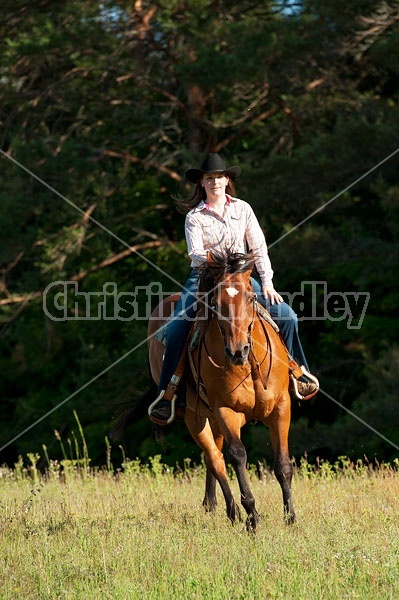 Young woman trail riding in Ontario Canada