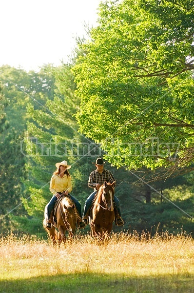 Husband and Wife Trail Riding Together