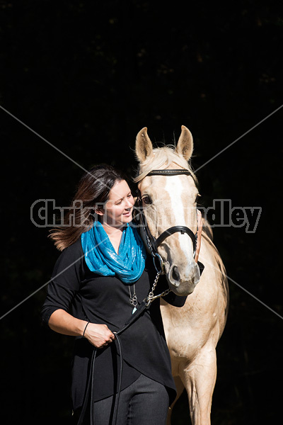 Woman with a palomino horse