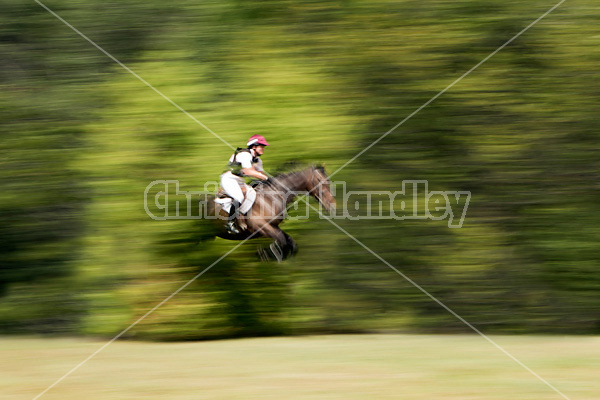 Woman riding cross country 