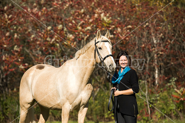 Woman with a palomino horse