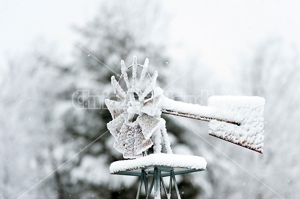Windmill frozen with ice and snow