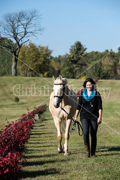 Woman with a palomino horse