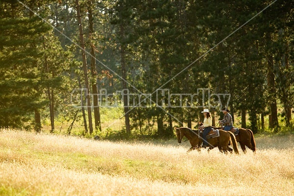 Husband and Wife Trail Riding Together